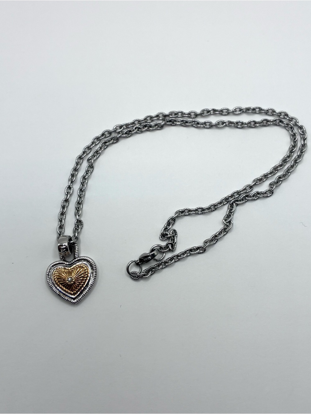 Diamonds International Two Toned Gold And Silver Ridged Heart Pendant Necklace.